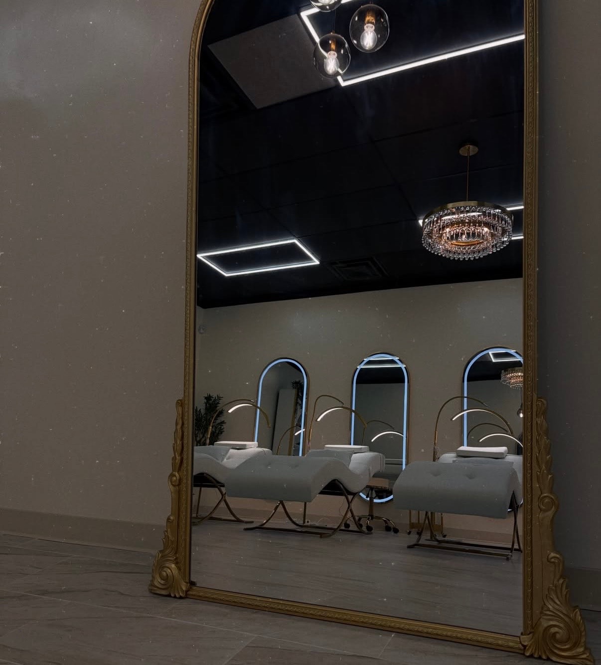 Lash Queen salon interior — luxury studio with crystal lighting and gold accents